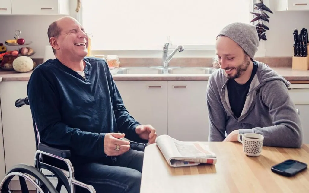 Two friends sharing a lighthearted moment while one recovers.